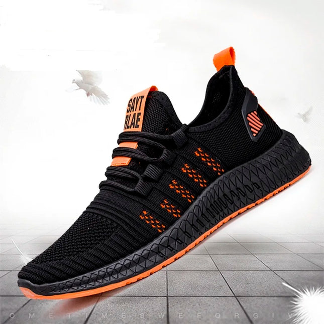 Black knit sneaker with orange sole stripe