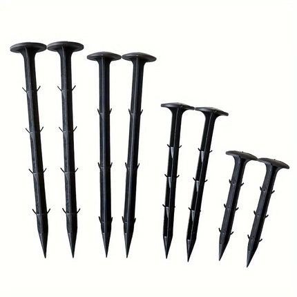 Eight black barbed ground stakes in four length pairs