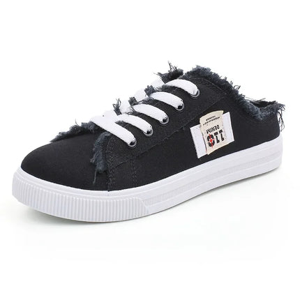 Black canvas sneaker mule with white laces and sole