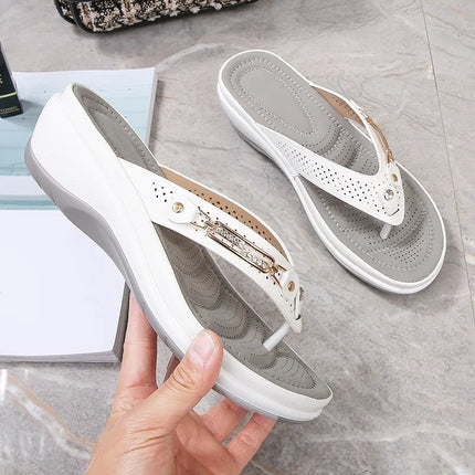 White thong wedge sandals showing side profile and contoured footbeds