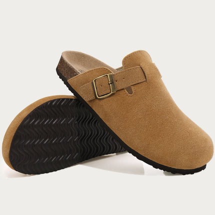 Tan buckle clogs showing the upper and patterned black outsole