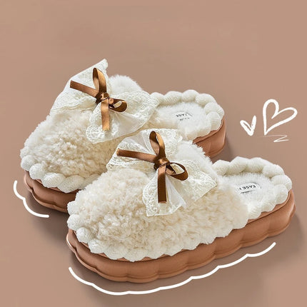 Cream plush house slippers with lace bows and brown soles