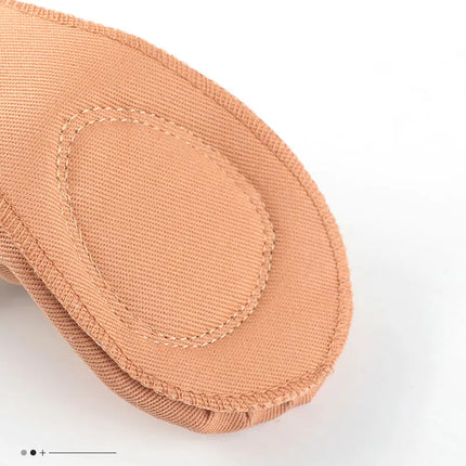 Interior stitching detail of a canvas ballet slipper