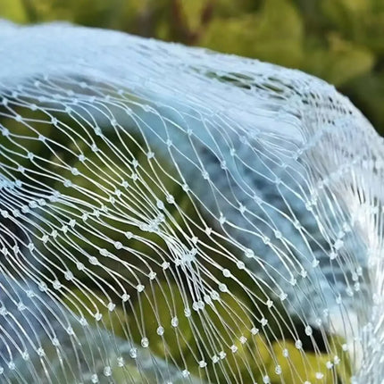 Close-up of bunched transparent diamond-mesh netting