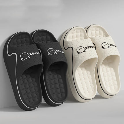 Black and cream bear-print EVA slides with textured footbeds