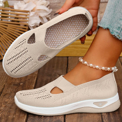Beige cutout knit sneakers showing the upper and inner footbed