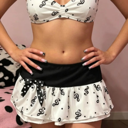 Y2K Music Note Print Mini Skirt, Black White Ruffle Micro Skirt with Polka Dot Bow,Kawaii Aesthetic Low Waist Skirt for Women