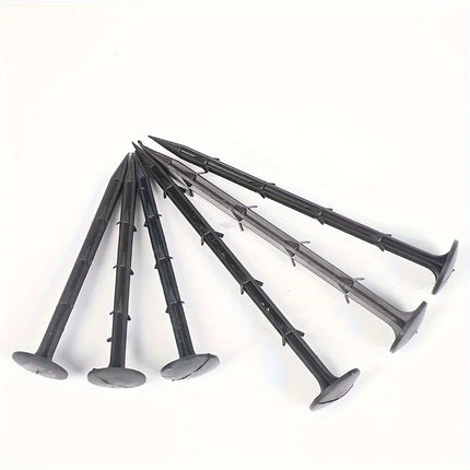 Six black landscape nails fanned out on a white background