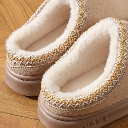 Close-up of the plush lining and stitched trim on beige slippers