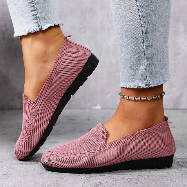 Woman wearing pink knit loafers