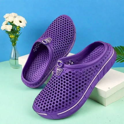 Purple slip-on clogs showing the perforated upper and open heel