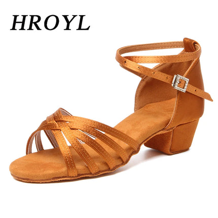Tan satin Latin dance shoe with crossed ankle straps and a low block heel