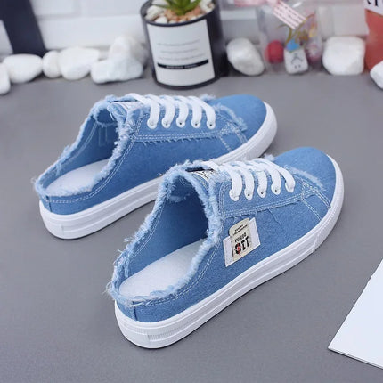 Blue canvas sneaker mules with open heels