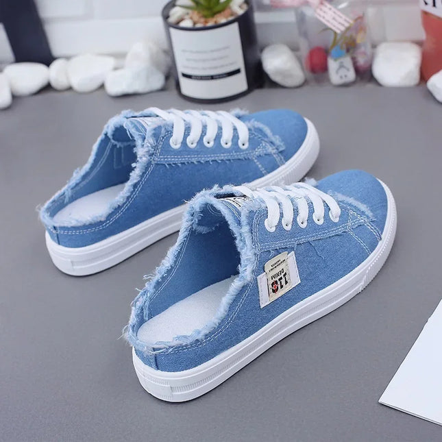 Blue canvas sneaker mules with open heels
