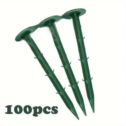 Three green plastic landscape stakes with a 100pcs label