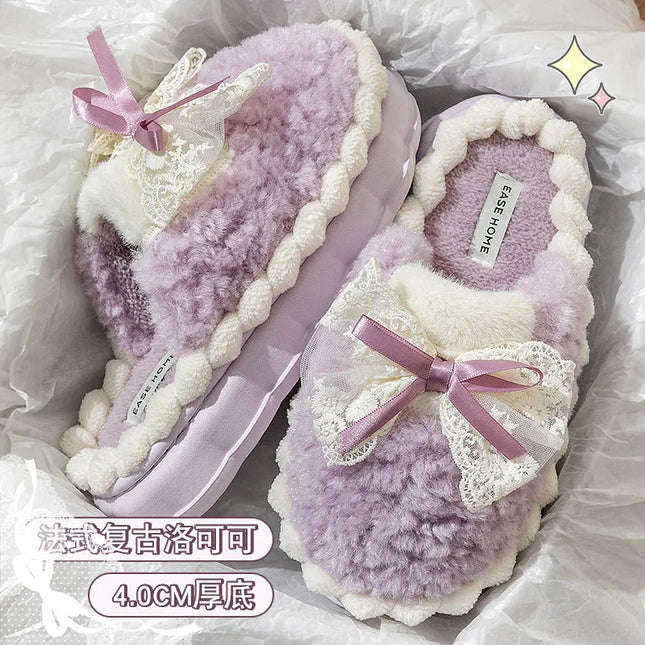 Lavender plush bow slippers showing the lining and thick soles
