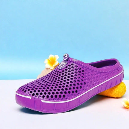Side view of a purple perforated slip-on clog