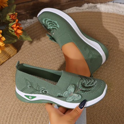 Green floral knit slip-on sneakers with white soles