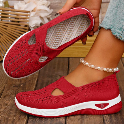Red knit slip-on sneakers showing the footbed and side profile